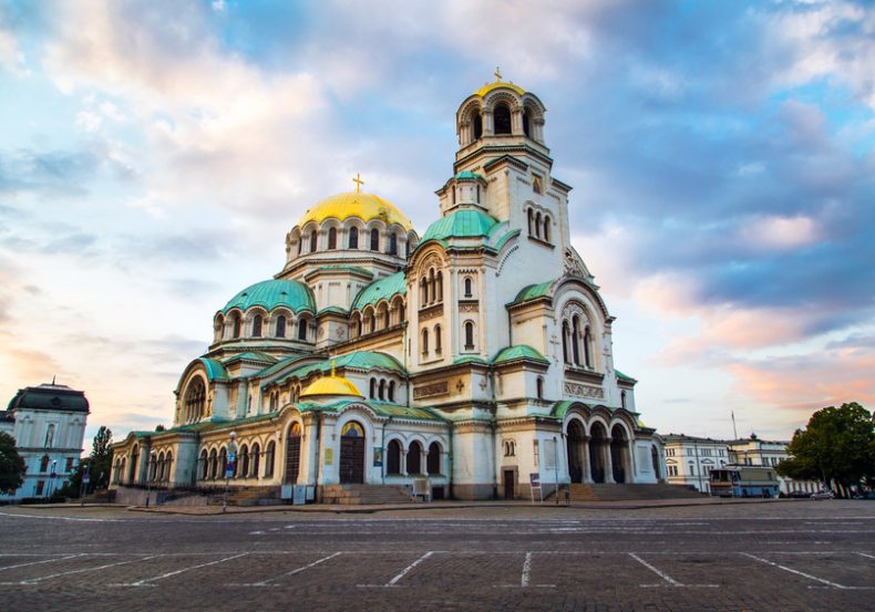 St. Alexander Nevsky Cathedral in the center of Sofia, capital of Bulgaria against the blue morning sky with colorful clouds